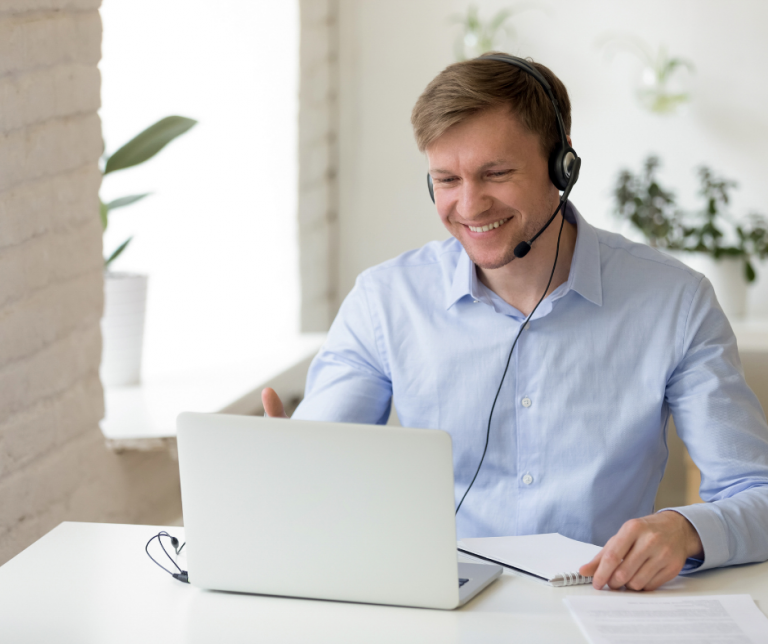 man using laptop for video conferencing