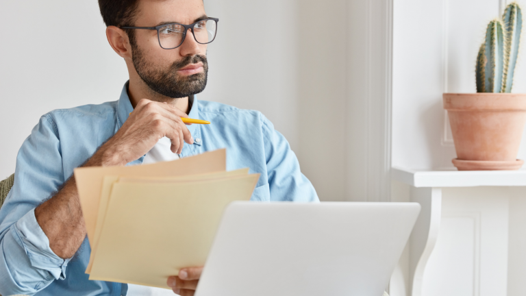 man thinking about hybrid workplaces