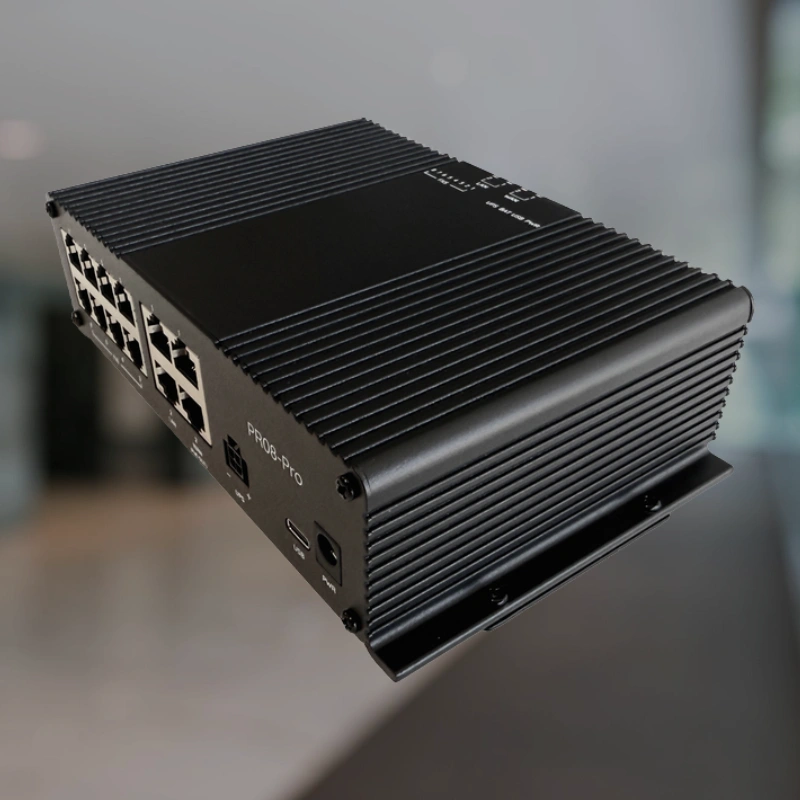 Black industrial communication device with multiple Ethernet ports, set against a blurred background, representing hardware for POTS Line Replacement connectivity.